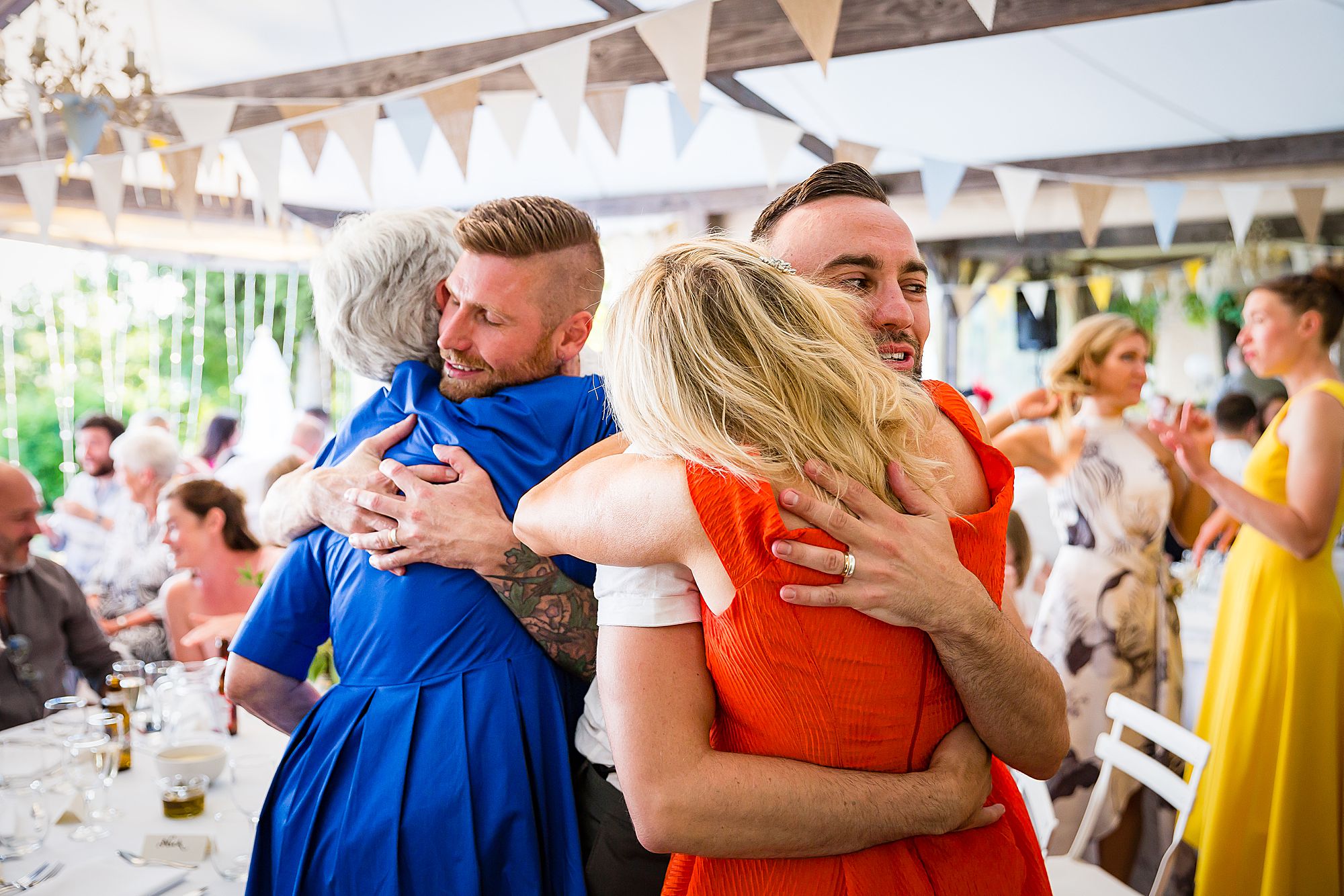 gay wedding in France grooms hug mums