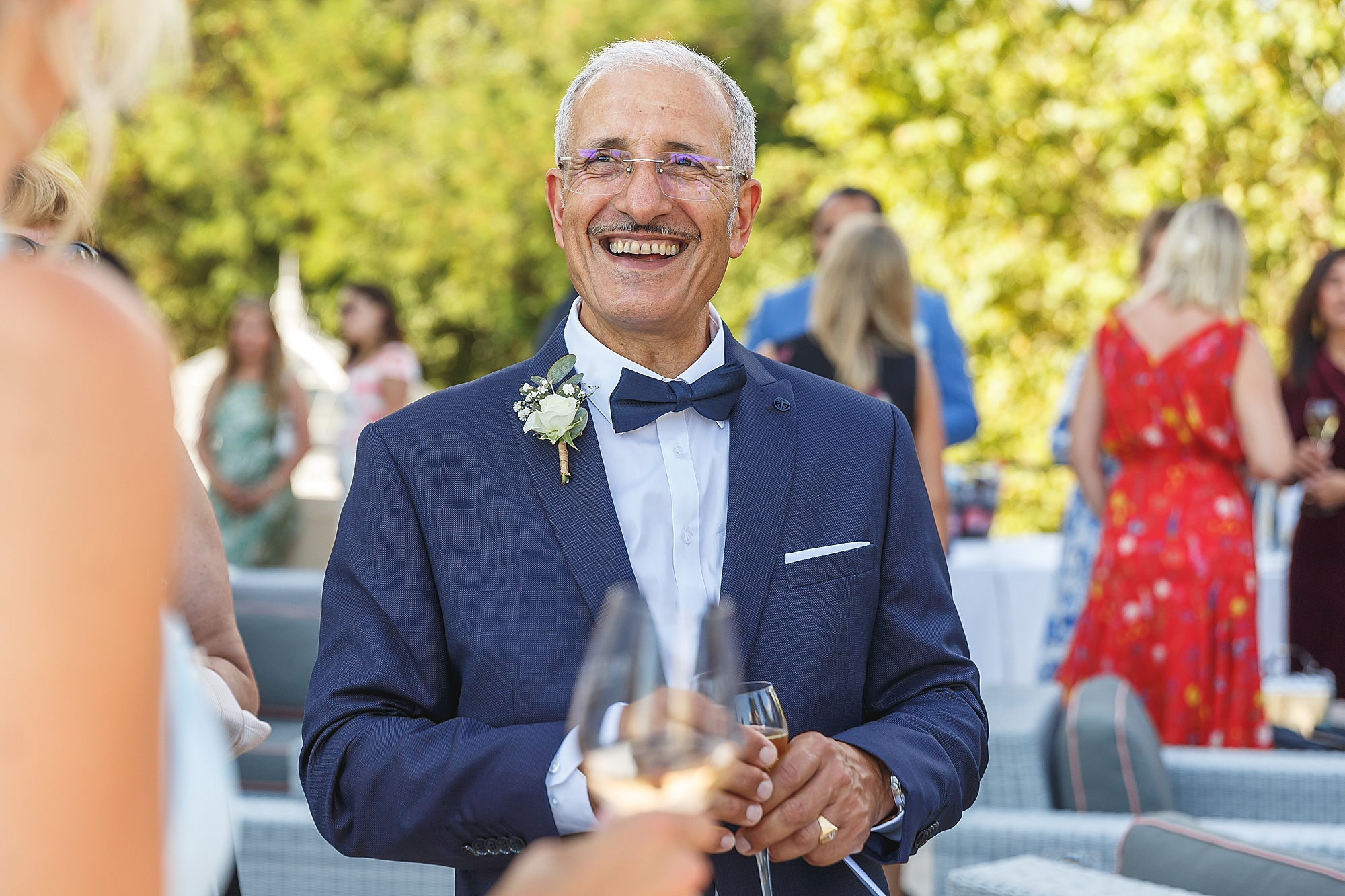 Father of the groom smiling